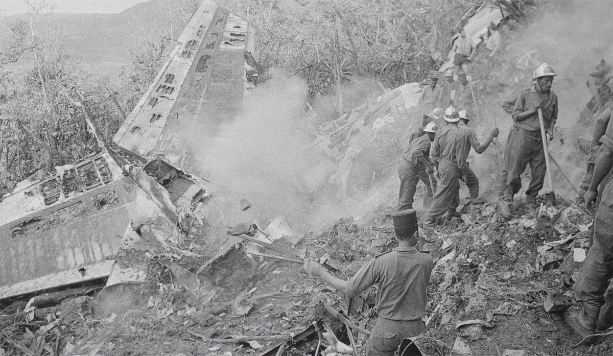 smouldering wreckage of Air France Boeing 707-328C F-BLJC with rescue workers on the flancs of La Soufriere vulcan, Guadeloupe