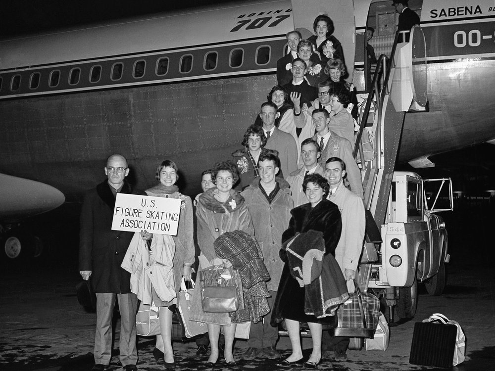 members of the U.S. Figure Skating Team pose before boarding Belgian Sabena plane at Idle Wild airport, February 1961