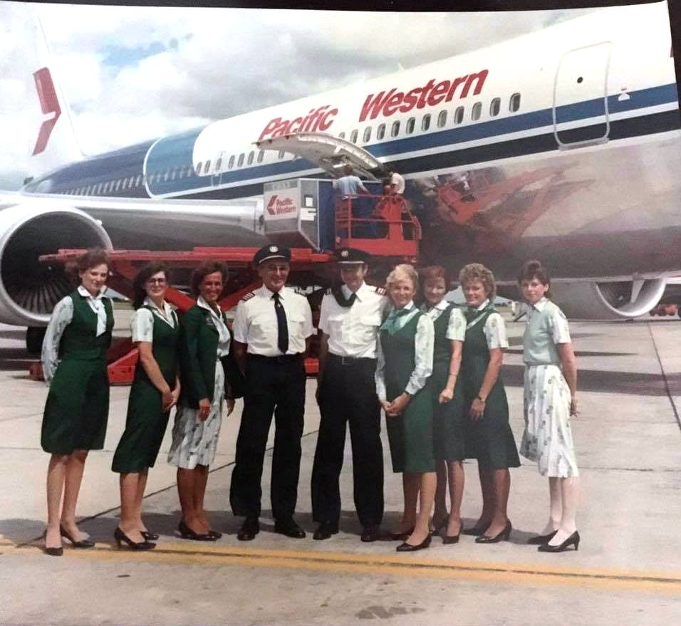 Boeing 767-275 | Pacific Western | C-GPWA or C-GPWB | crew posing in front of 767-200 | LD2 container loaded in belly 767