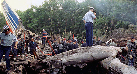 Airbus A320-111 Air France flight AF296 | picture of crash site Habsheim | F-GFKC police officer standing with portephone on the wreckage while others searching for victems