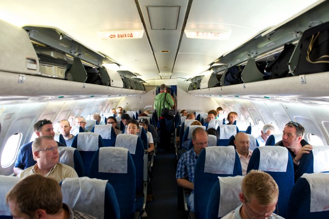 Tupolew Tu-154M cabin picture | By the time I got on board, things were much too crowded to take any cabin shot that could be described as "uncluttered". - Photo: Bernie Leighton | AirlineReporter